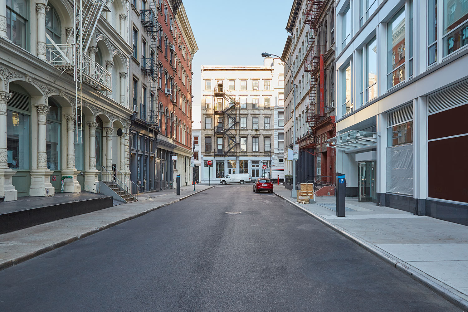 New York - September 7, 2016: Soho empty street with cast iron buildings in a sunny day in New York. The name comes from South of Houston Street.